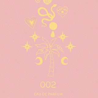 NFD Eau De Parfum 002 graphic print in pink and yellow featuring a central palm tree, crescent moons and celestial stars.