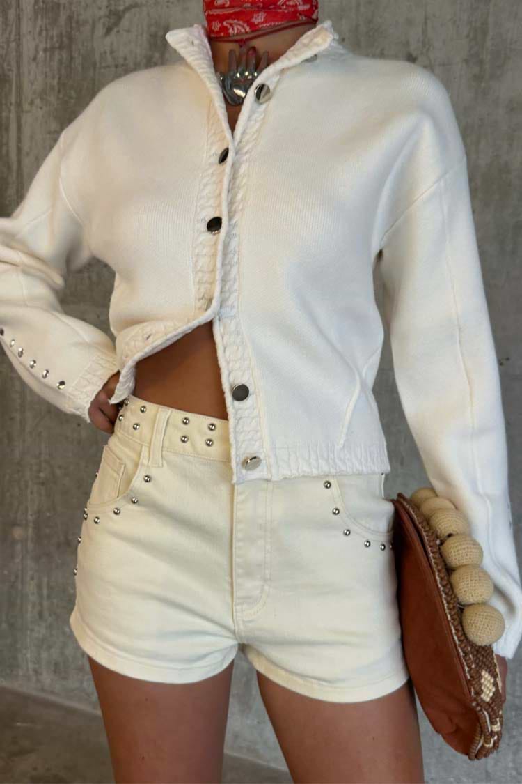 Ecru Studded Hot Pant featuring silver stud detailing on cream denim, styled for a festival look.