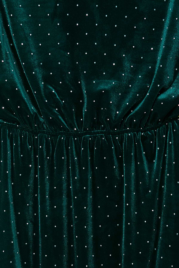 Emerald Velvet Tilly Dress detail showcasing the gathered waist and silver dot pattern on green velvet fabric.