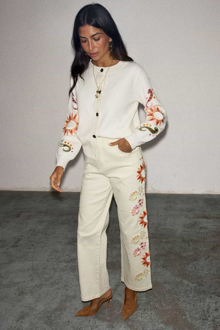 Ecru Enchanted Cut Work Scallop Jeans featuring sun embroidery and a wide-leg fit, paired with a matching cardigan.