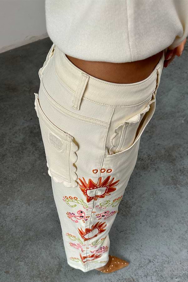 Ecru Enchanted Cut Work Scallop Jeans featuring colourful embroidery and scalloped edge pockets.