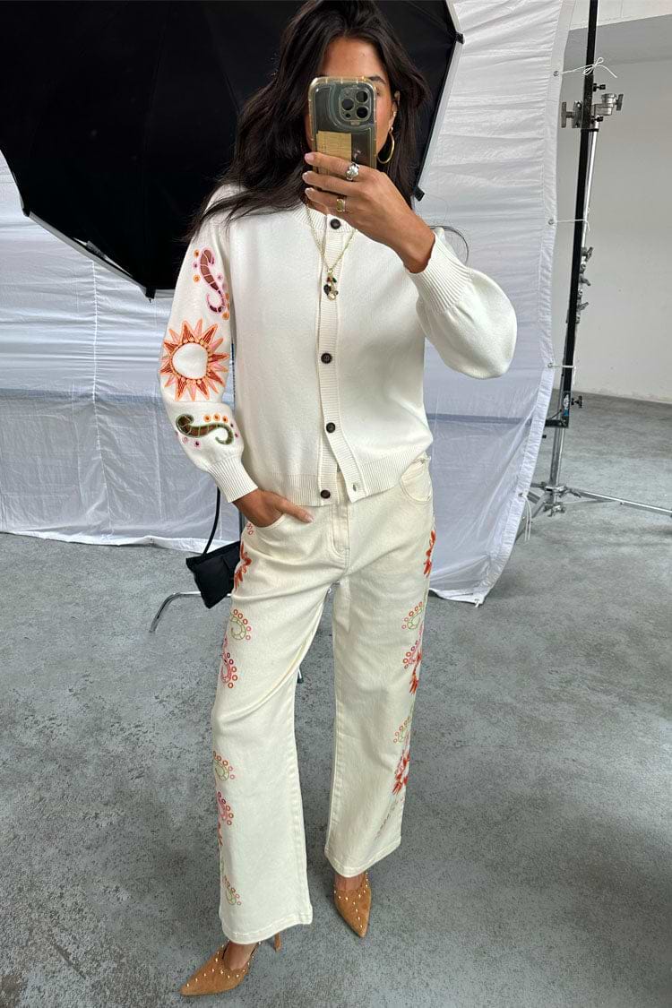 Ecru Enchanted Cut Work Scallop Jeans with colourful embroidery and a wide-leg fit, shown in a studio mirror selfie.