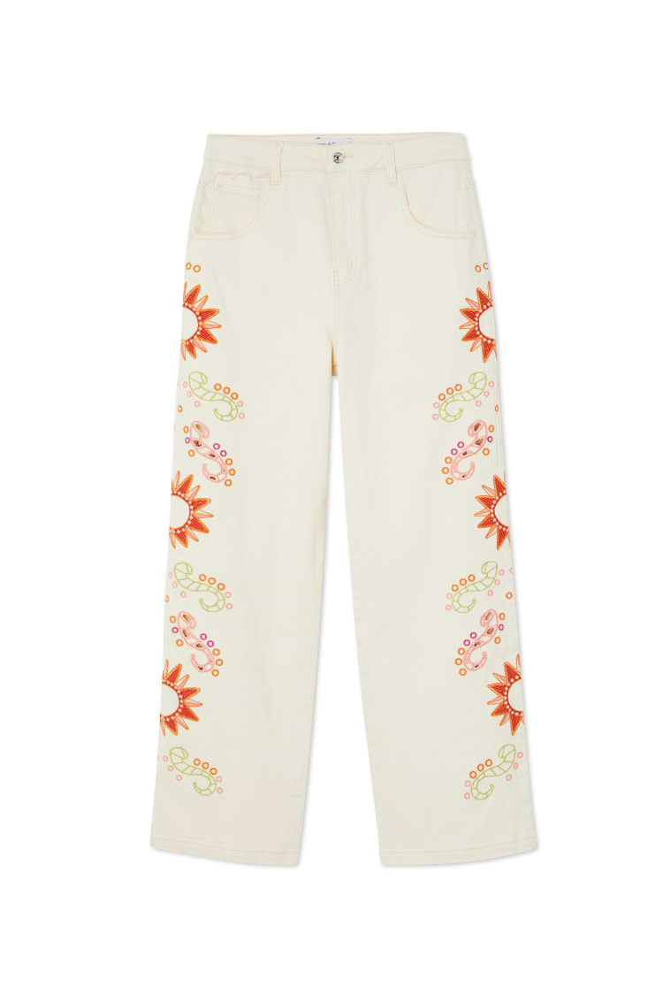 Ecru Enchanted Scallop Jeans in wide-leg denim featuring sun embroidery and scalloped pockets.