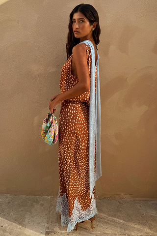 Brown Fawn Midi Maeva Skirt featuring a white spotted print and a light blue lace border at the hem.