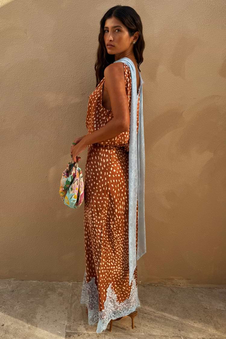 Brown Fawn Midi Maeva Skirt featuring a white spotted print and a light blue lace border at the hem.