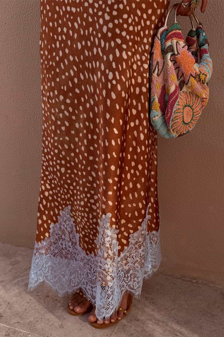 Fawn Midi Maeva Skirt featuring a brown fawn print and delicate lace trim, styled with a colourful beaded bag.