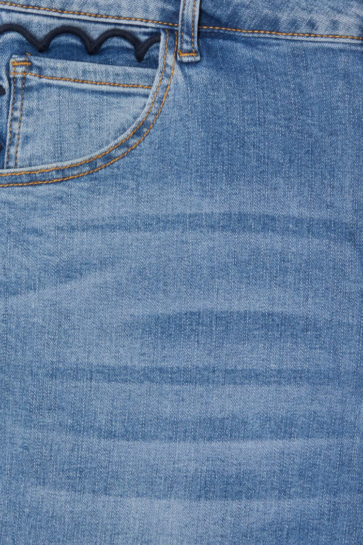 Blue Denim Flare Scallop Jean detail with a navy scalloped pocket trim and contrasting gold stitching.