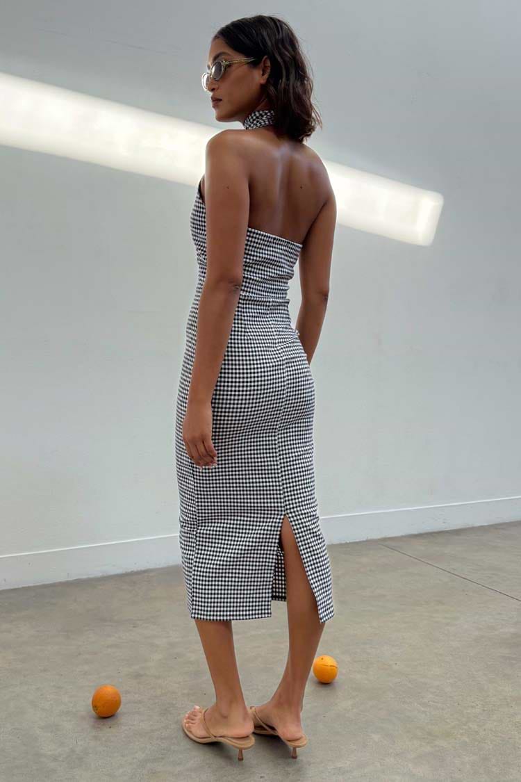 Black and white Gingham Halterneck Midi Dress featuring a back slit, styled with sunglasses and heels.