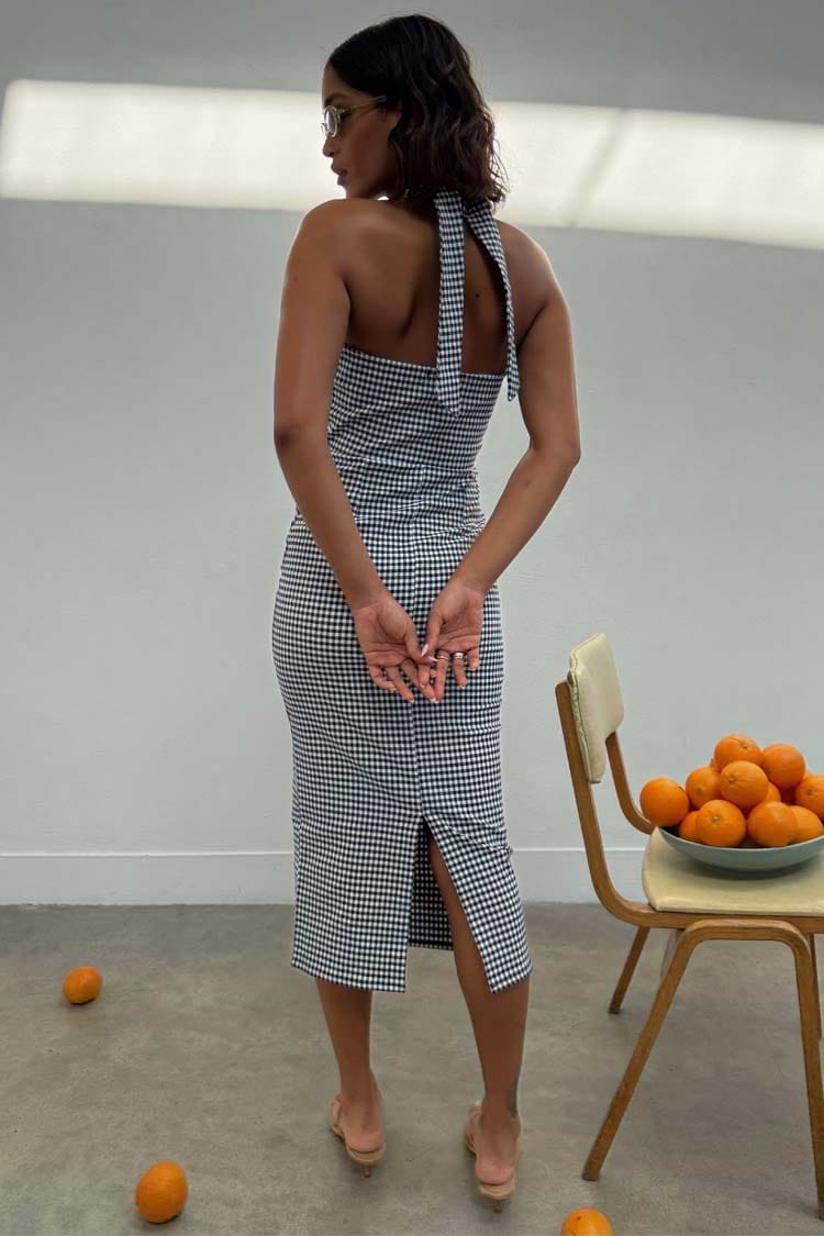 Gingham Halterneck Dress in a black and white chequered print featuring a back slit and tie-neck detail.