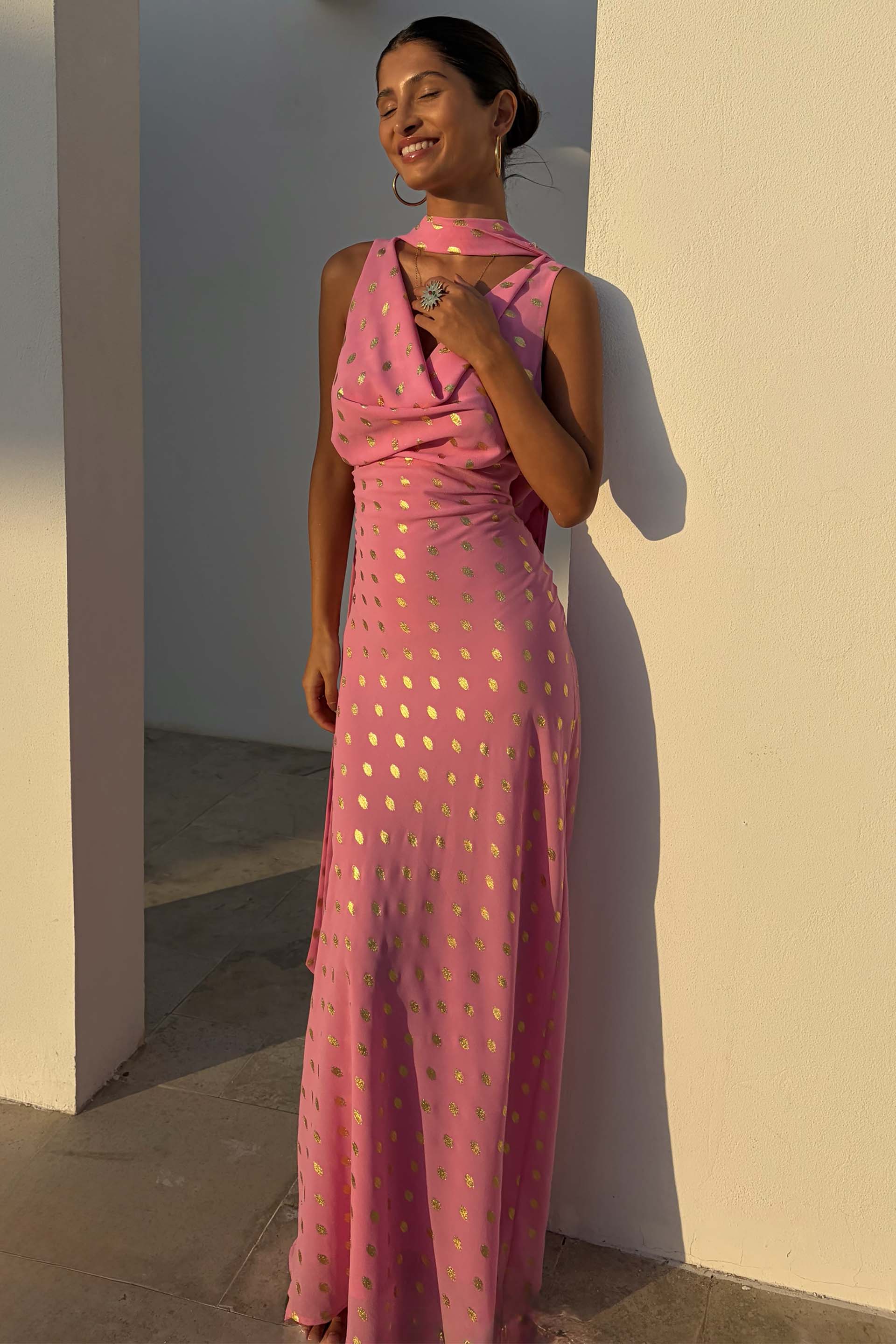 Pink Sophie Dress with gold flecks and multi-wear scarf, featuring a bias-cut drape on a model.