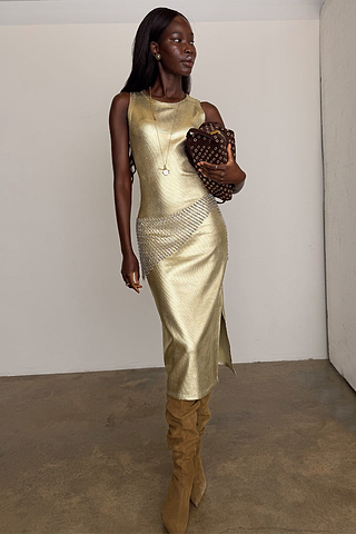 Gold Metallic Ribbed midi dress with a sleeveless design and side slit, styled with slouchy boots.