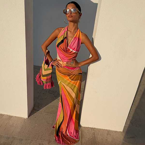 Green Abstract Sabine Maxi Dress featuring a vibrant multicoloured wavy print, cowl neckline, and halter neck.