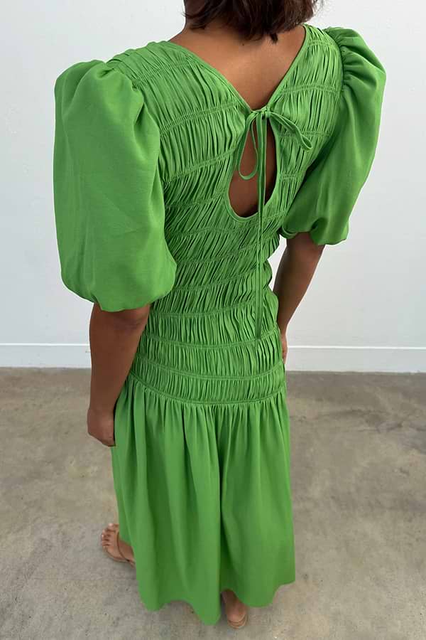 Green Shirred Nara Dress with a multi-wear tie-neck, puffed sleeves and shirring, designed in London.