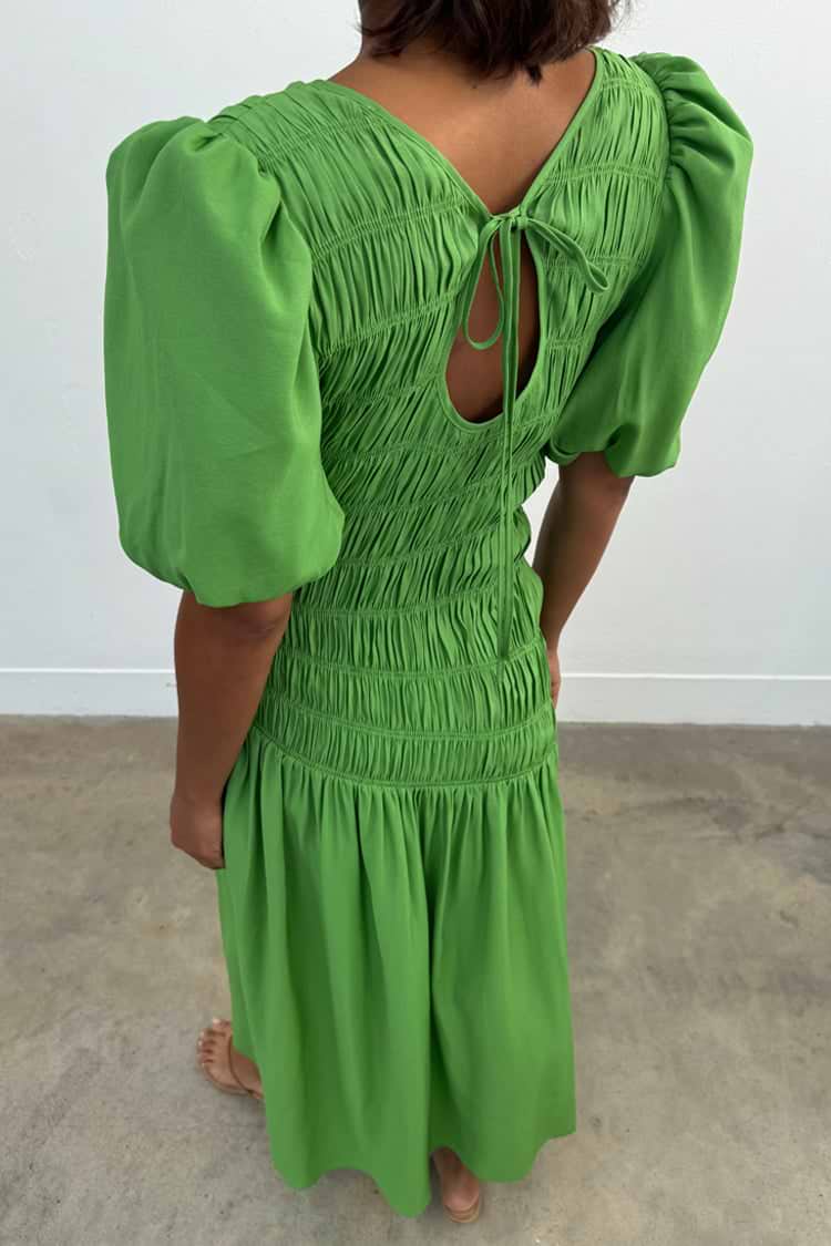 Green Shirred Nara Dress with a multi-wear tie-neck, puffed sleeves and shirring, designed in London.