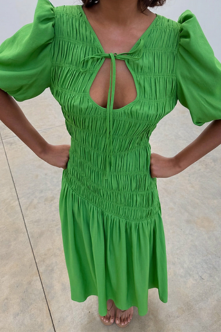 Green Shirred Nara Dress featuring a multi-wear tie neck, puff sleeves, and an elasticated smocked bodice.