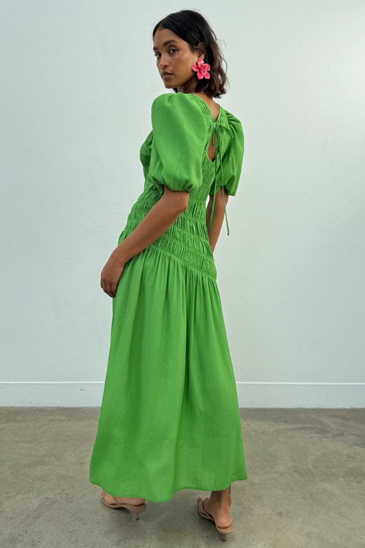 Green Shirred Nara midaxi dress with puff sleeves and a multi-wear tie neck fastening.
