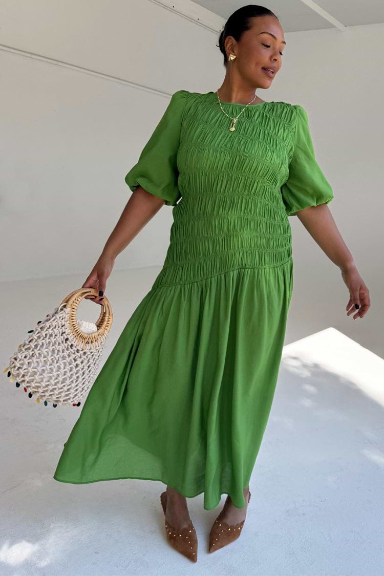 Green Shirred Nara Dress with a shirred bodice and puff sleeves, highlighting inclusive sizing.