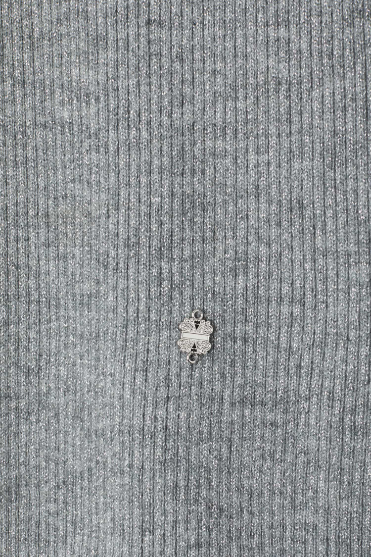 Gunmetal Rib Knit Jumper detail with grey shimmering rib fabric and a small silver metal NFD logo.