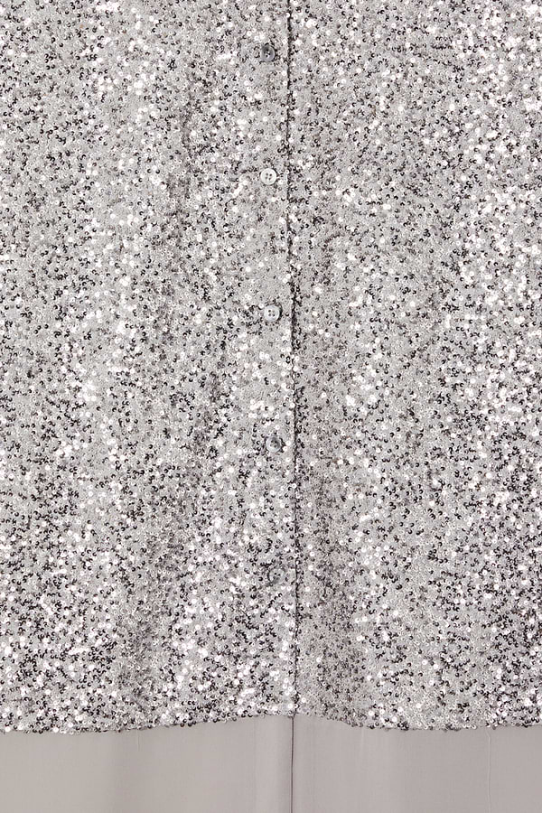 Shimmering gunmetal silver sequins and button-up front detail on the Lila Shirt Dress.