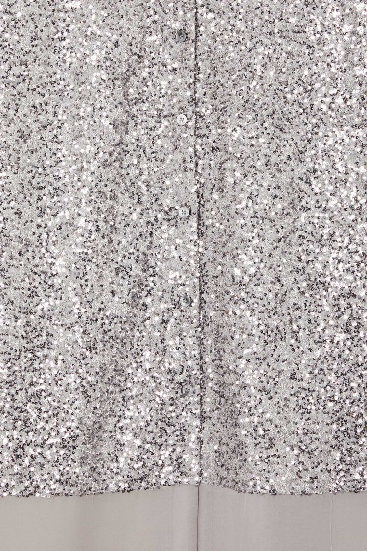 Shimmering gunmetal silver sequins and button-up front detail on the Lila Shirt Dress.
