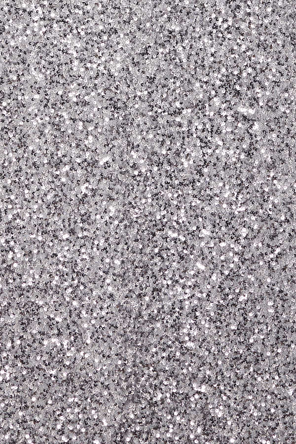 Shimmering gunmetal grey sequins on the Soho Dress, highlighting the dense metallic sparkle of the fabric.