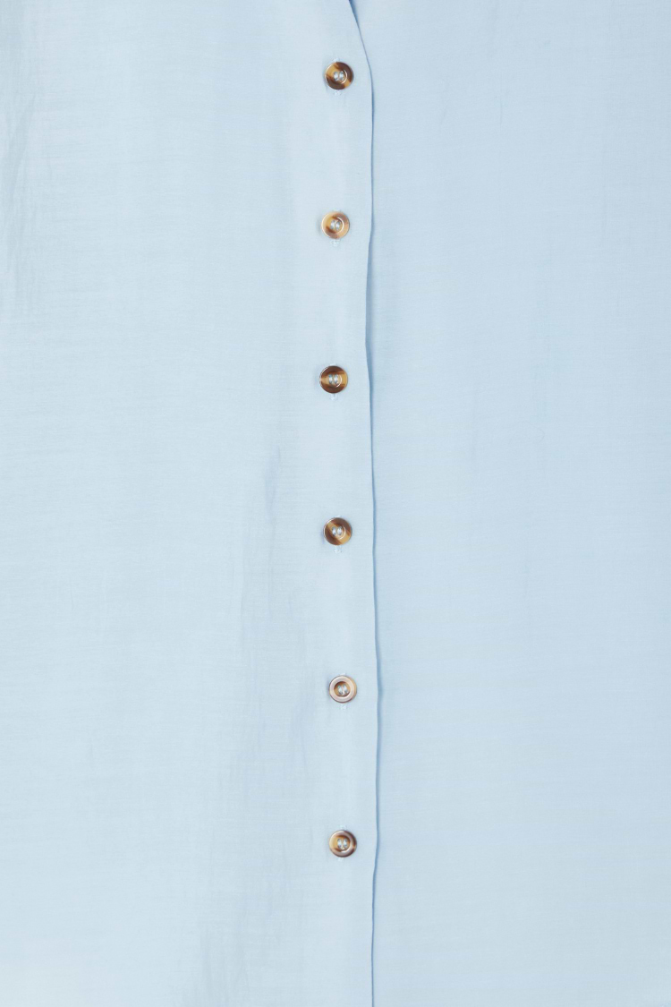 Ice Blue Miley Shirt detail with contrast tortoise buttons on sky blue, lightweight and slightly sheer fabric.