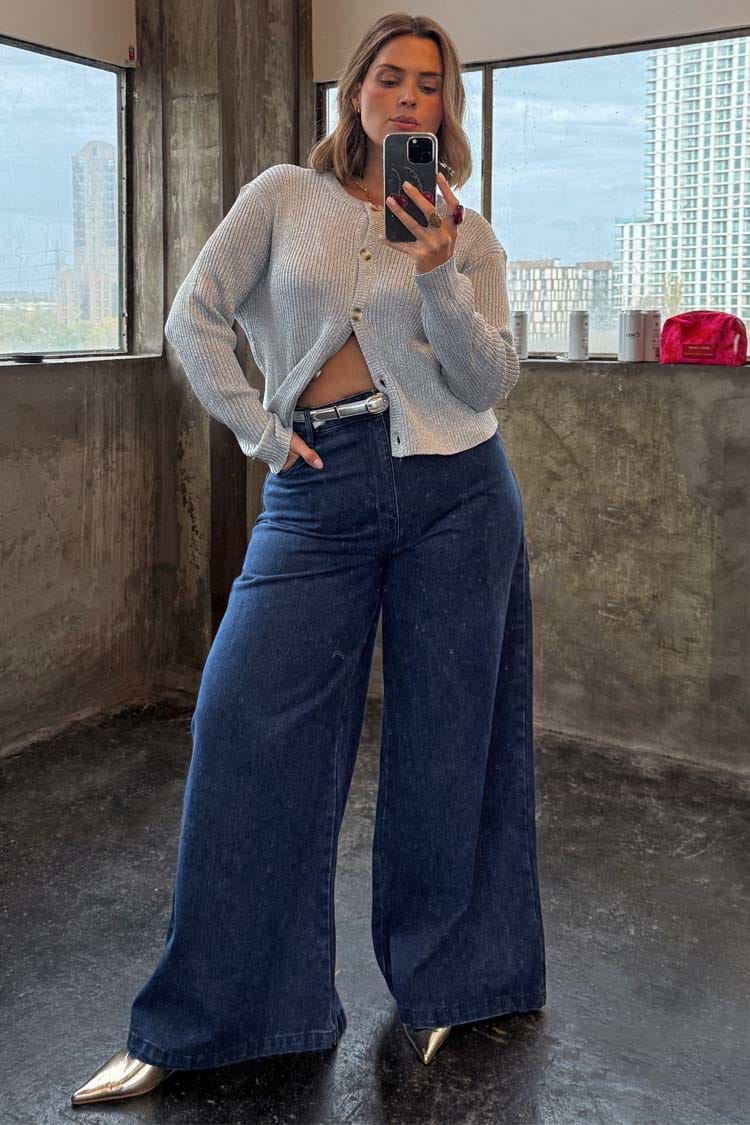 Blue Denim Pallazzo Jan Jean with a voluminous wide-leg fit, styled with a silver cardigan for an effortless London look.