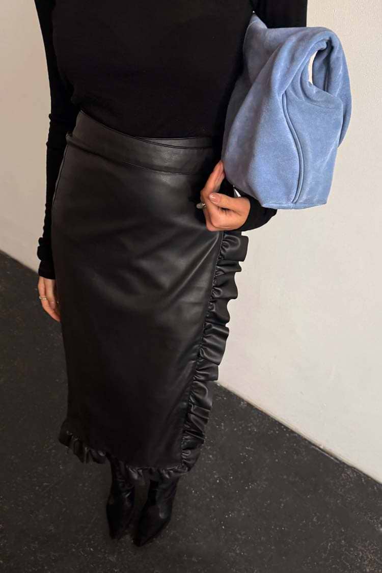 Black Vegan Leather Ruffle Jaspre Skirt featuring a wrap-tie waist and frill trim detailing.
