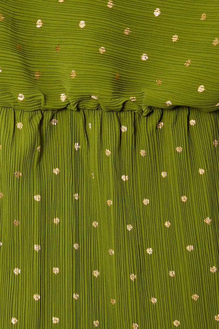 Khaki Mini Plisse Tilly Dress detail highlighting the textured green fabric, gold fleck print and elasticated waist.