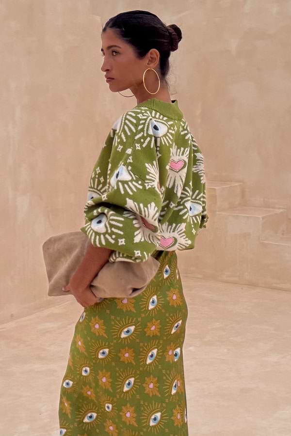 Khaki Eye Dorris Skirt and matching cardigan featuring green and pink heart and eye motifs, designed in-house in London.