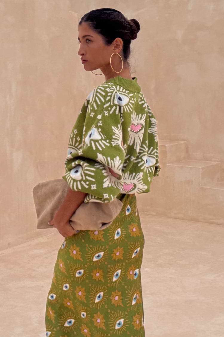 Khaki Eye Dorris Skirt and matching cardigan featuring green and pink heart and eye motifs, designed in-house in London.