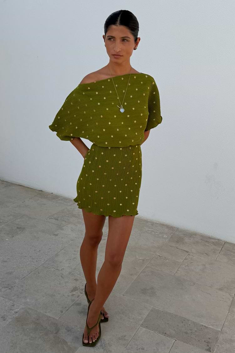 Khaki mini plisse Tilly dress with gold flecks and an elasticated waist seam on a model.