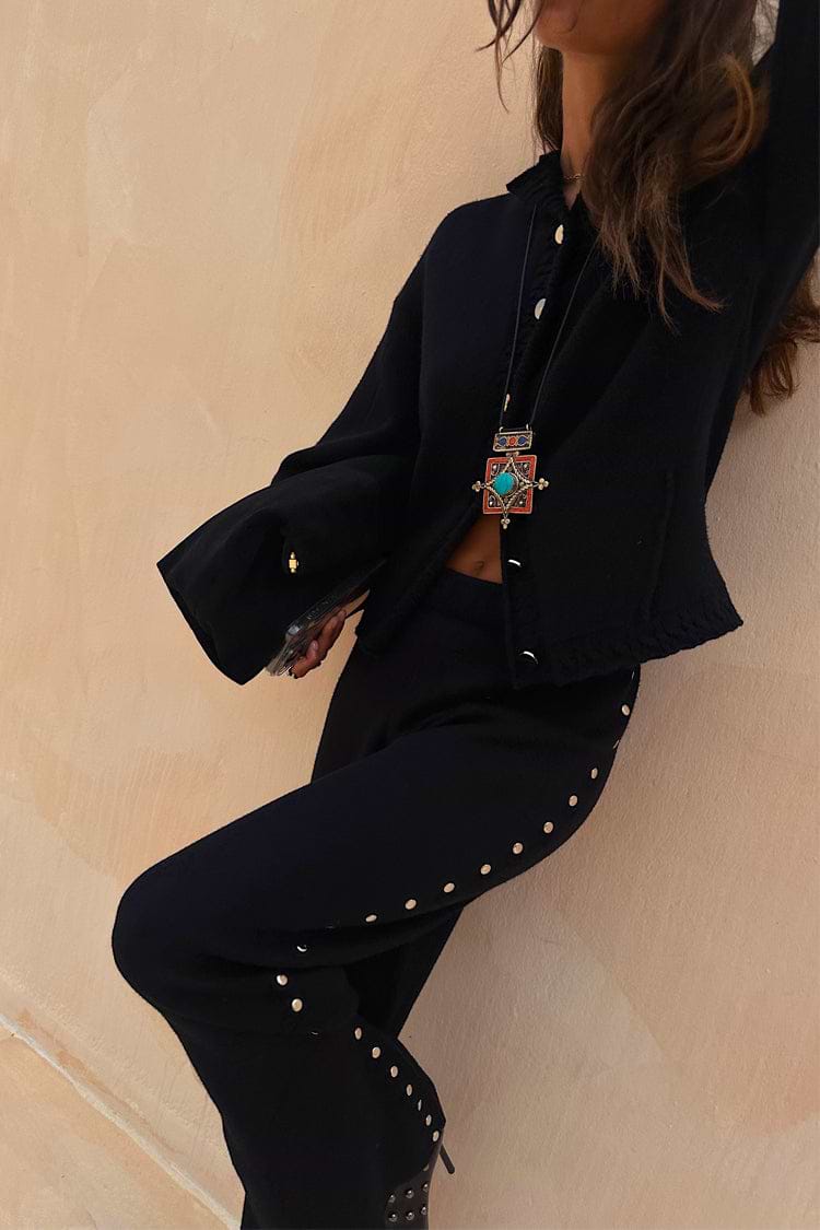 Black Studded Knit Trousers featuring silver metal studs down the leg, styled as a soft knitwear co-ord.
