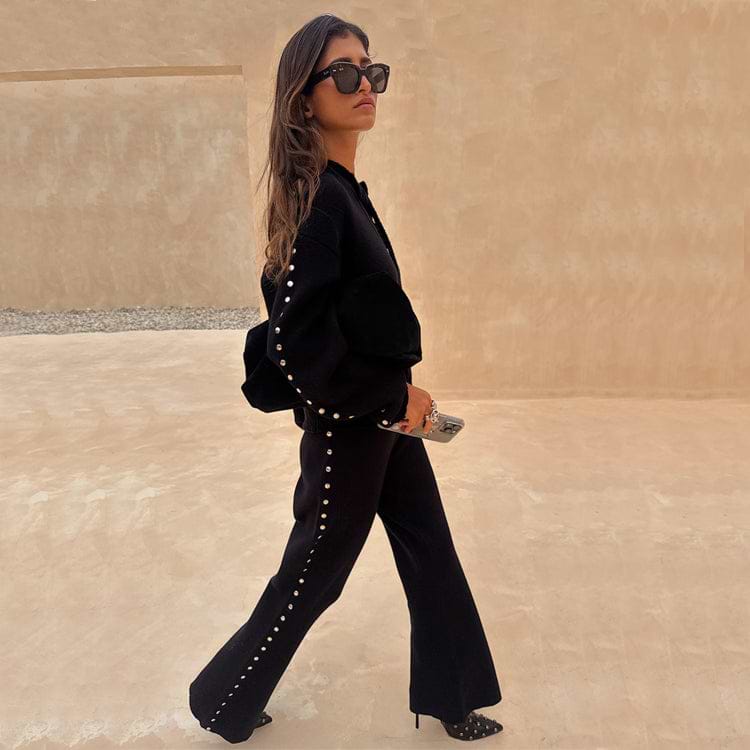 Black Studded Knit Trousers with silver metal studs, styled as a monochrome co-ord with a matching cardigan.