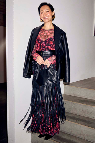 Black Leather Blazer draped over a cherry-print dress and fringed bag for a multi-wear transeasonal look.