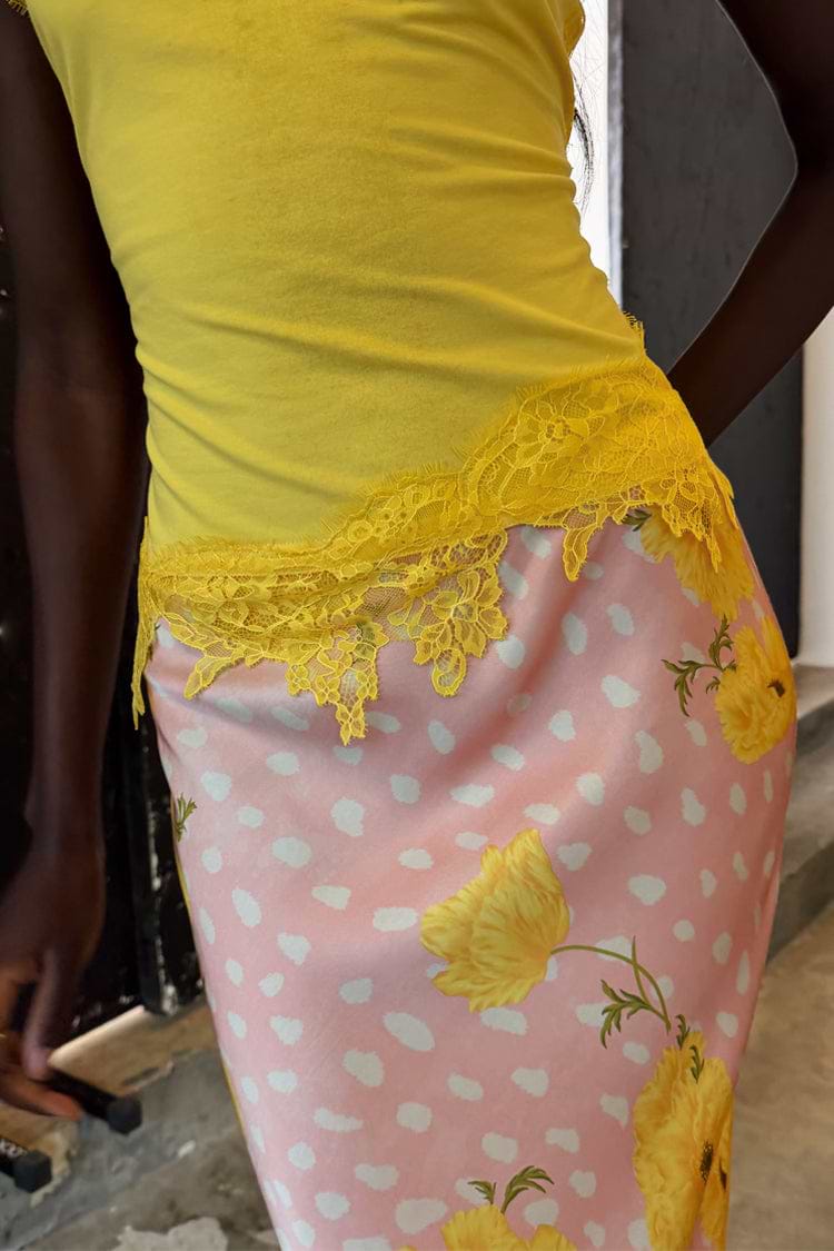 Yellow Lace Insert Top featuring an asymmetric lace hem and intricate floral lace, designed in London.