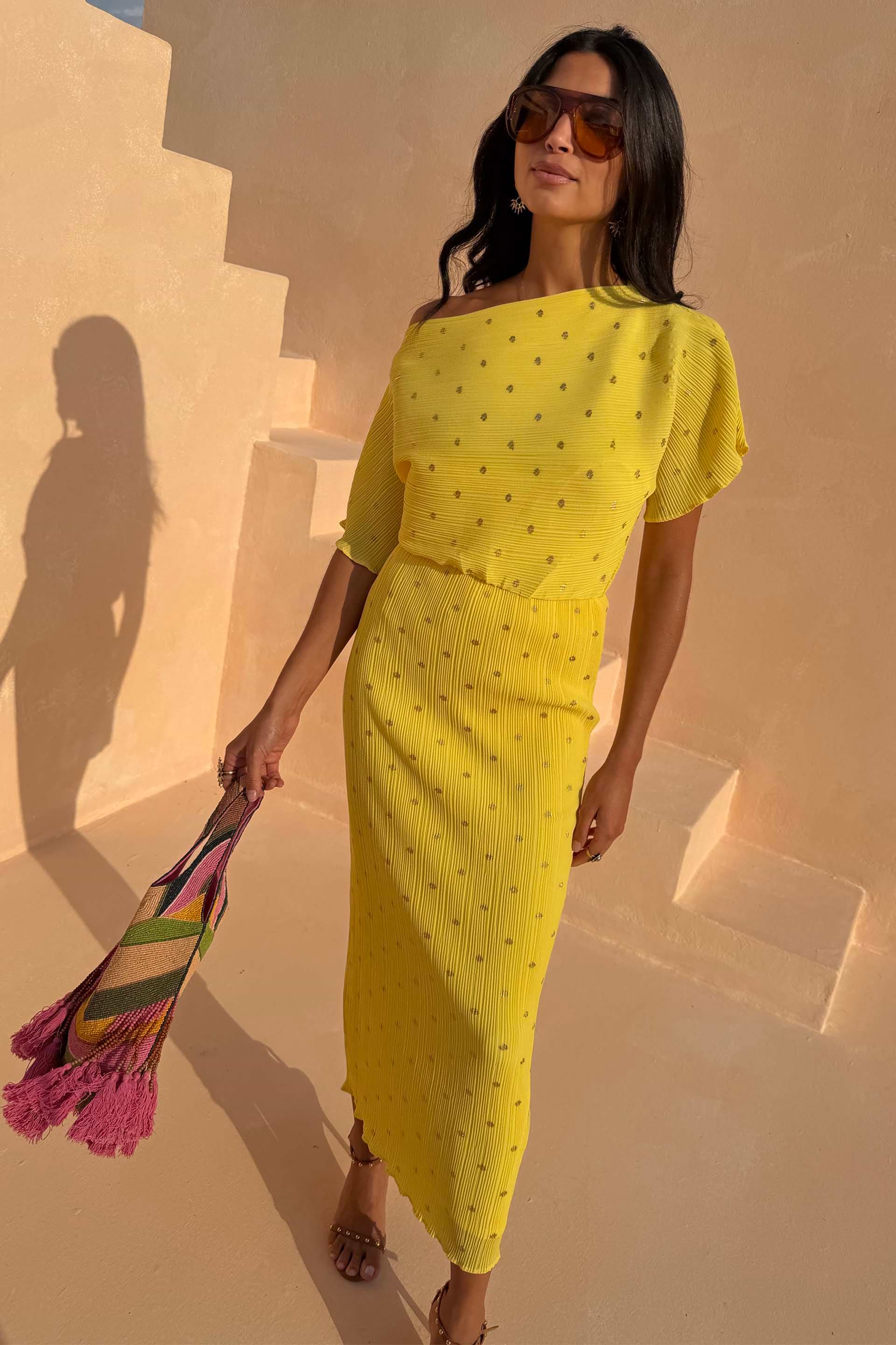 Yellow Sunshine Tilly Dress in plisse with gold flecks, worn by a 5ft7” model in size UK 10/US 6.