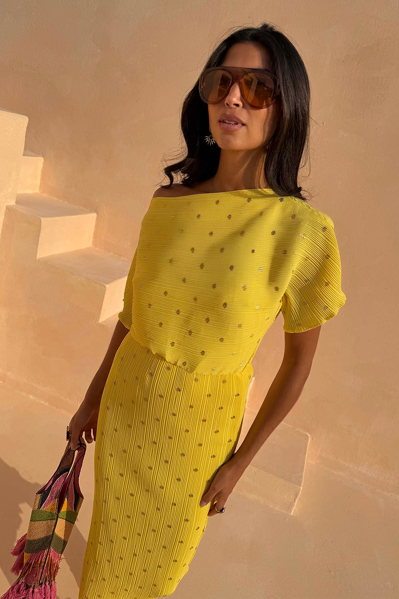 Yellow Sunshine Tilly Dress in plissé fabric with gold flecks and an off-the-shoulder neckline.