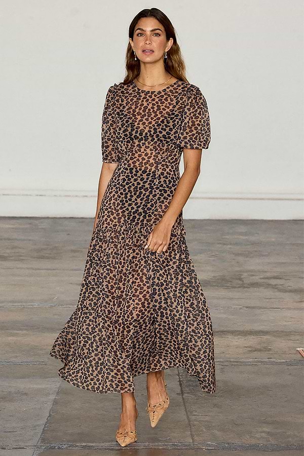 Leopard Lucia Dress featuring a sheer leopard print, voluminous puff sleeves and a tiered drop waist.
