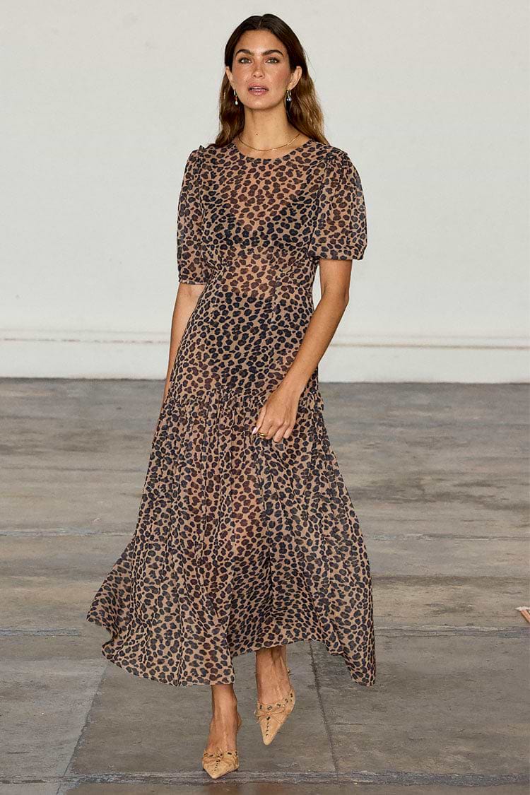 Leopard Lucia Dress featuring a sheer leopard print, voluminous puff sleeves and a tiered drop waist.