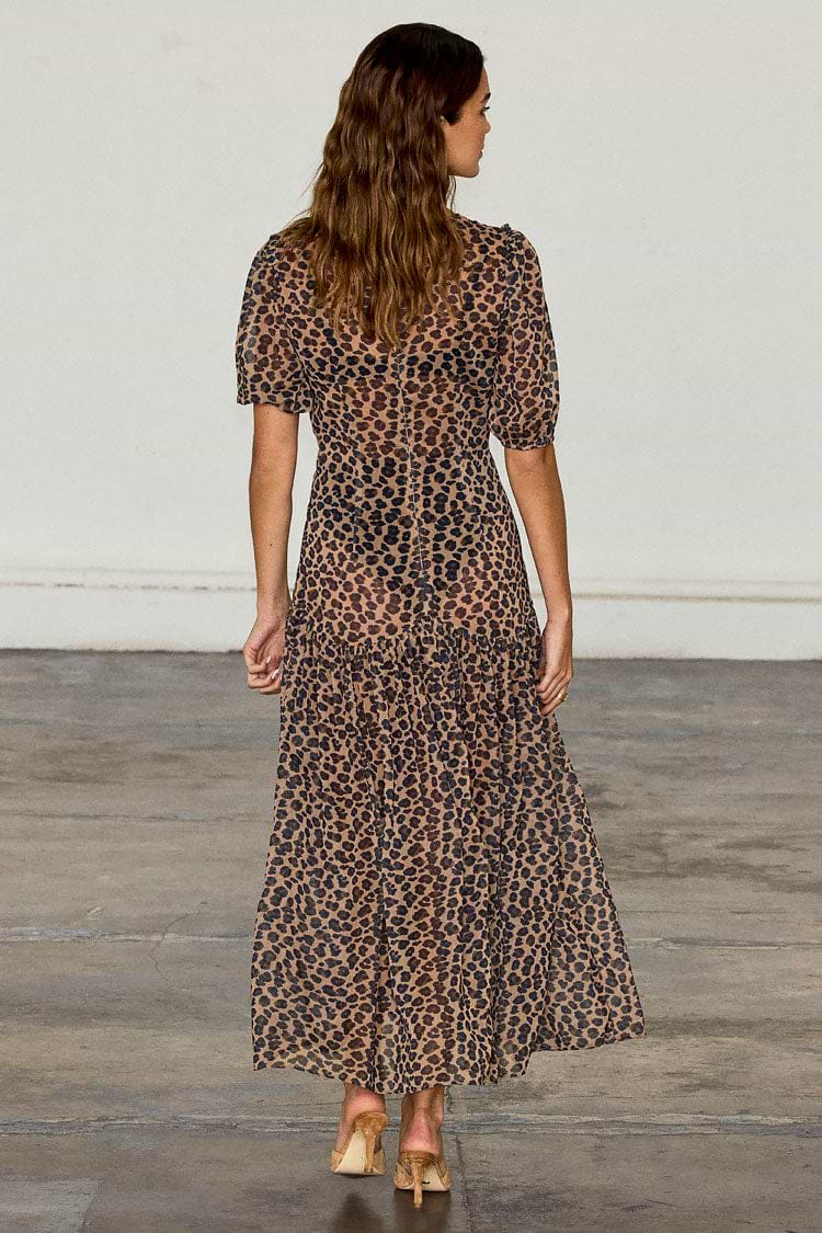 Leopard Lucia Dress in sheer animal print with puff sleeves and a tiered skirt, shown from the back.