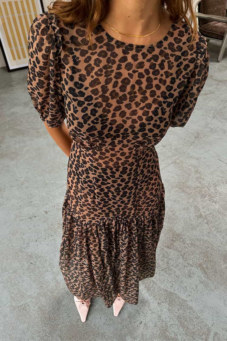Sheer Leopard Lucia Dress featuring puff sleeves and a tiered skirt in an iconic leopard print.
