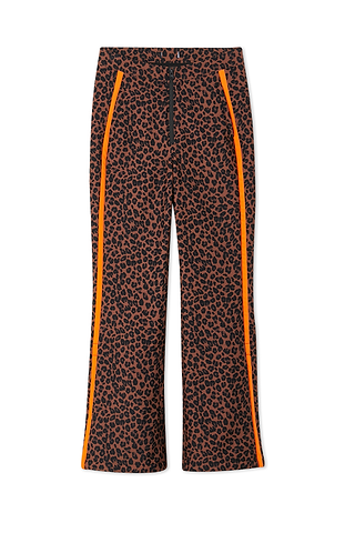 Leopard Ski Trousers featuring vibrant orange side stripes, a high-waisted fit, and functional front zip closure.