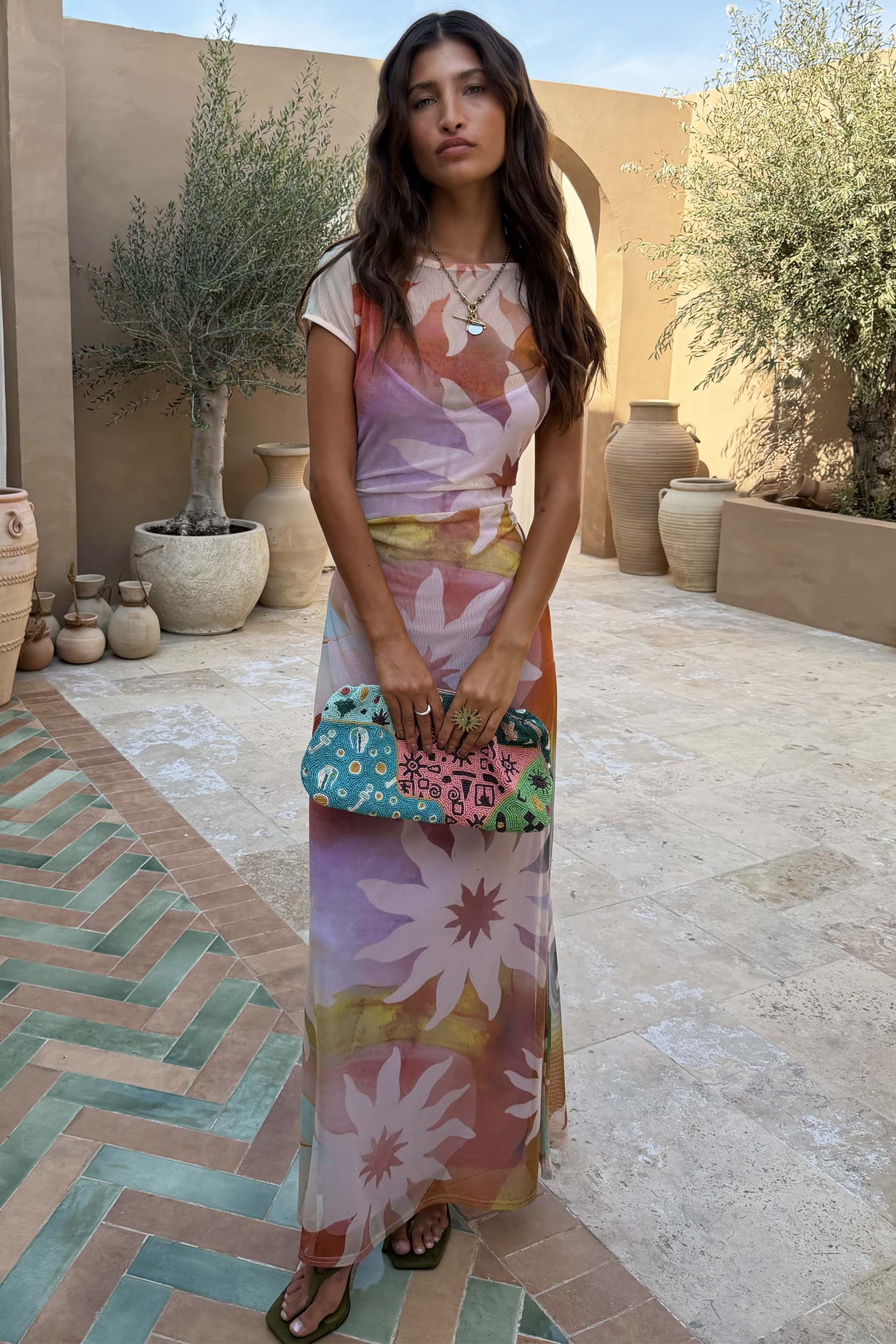 Abstract Soleil Luna Mesh Dress featuring multicoloured sun motifs on sheer mesh with short sleeves.