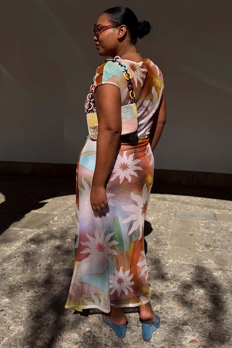 Abstract Soleil Luna Mesh Dress in a multicoloured sun print with a stretchy finish, styled on a curve model.