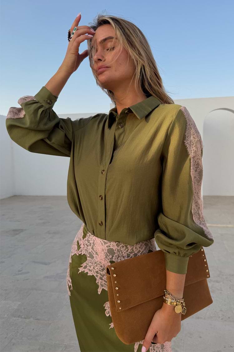 Olive & Pink Lace Marley Shirt with pink lace sleeve panels, styled with a matching skirt in a bright outdoor setting.