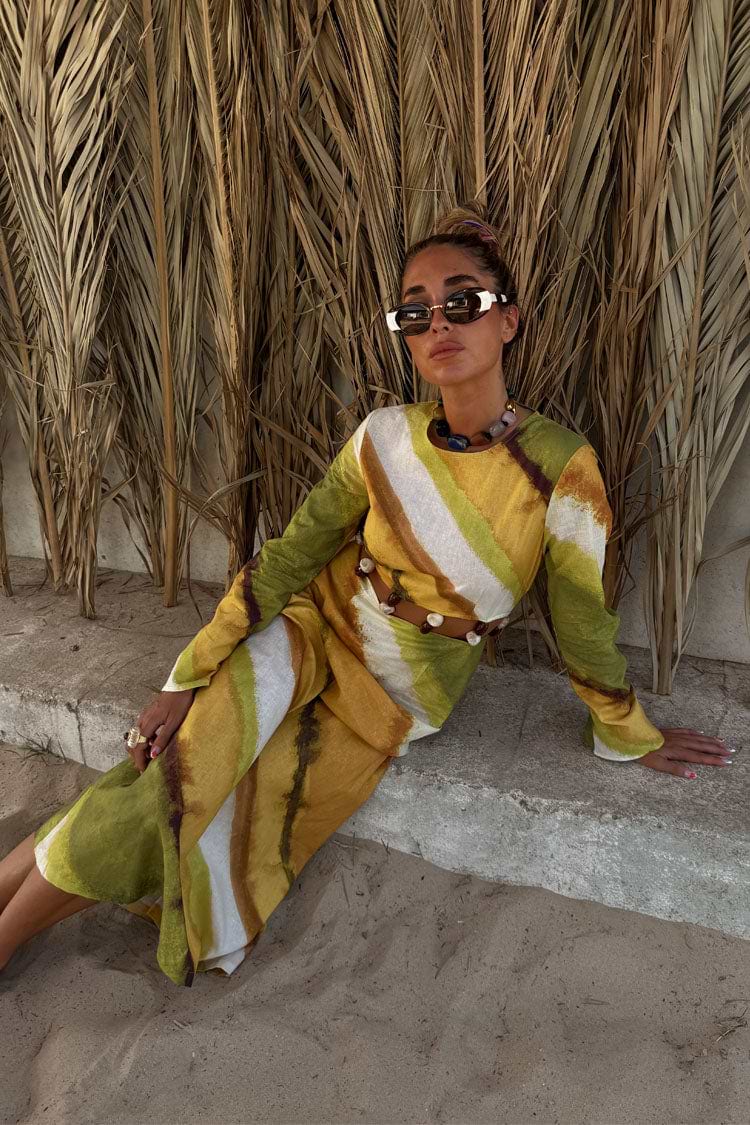Green Ombre Alba Dress in a cotton-linen blend with earthy tones, cut out waist and stone beading for a vacation look.