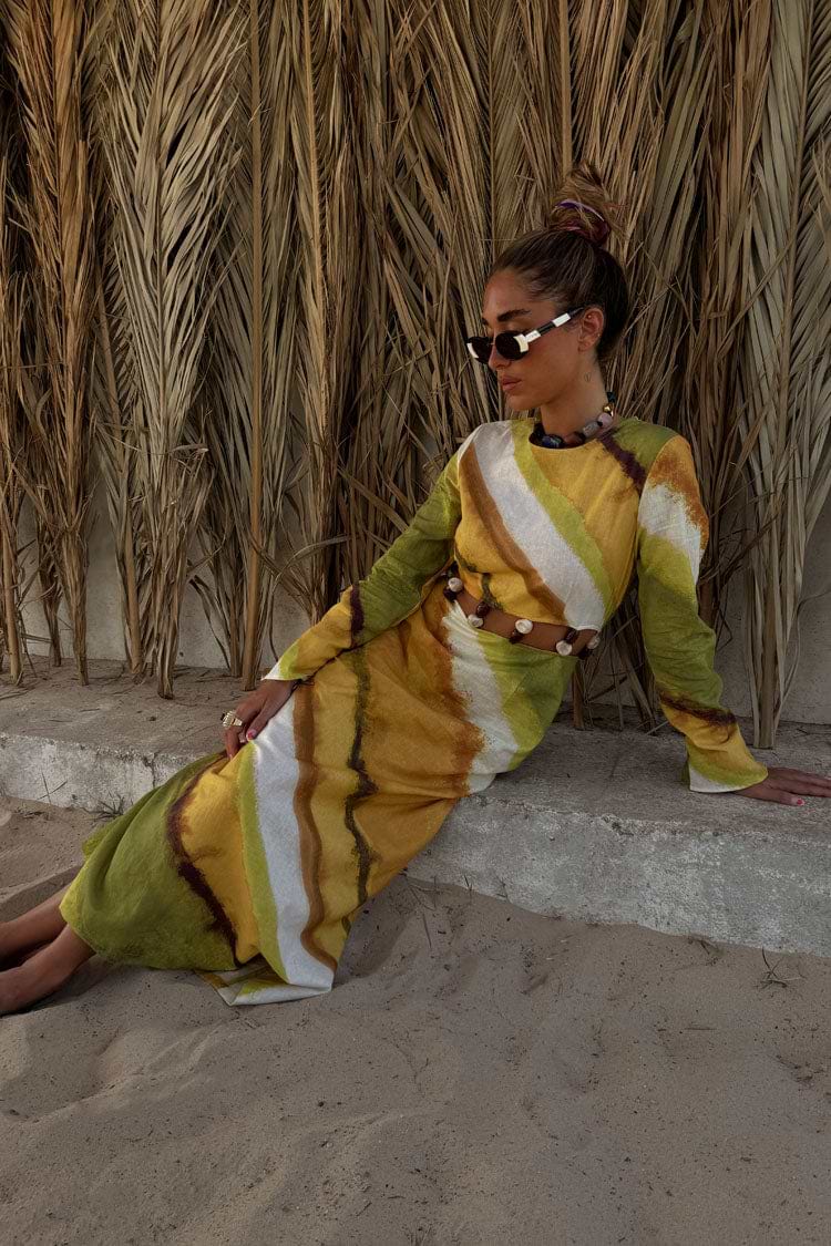 Green Ombre Alba Dress with a cut-out waist and stone beading in an earthy cotton-linen blend, styled for vacation.