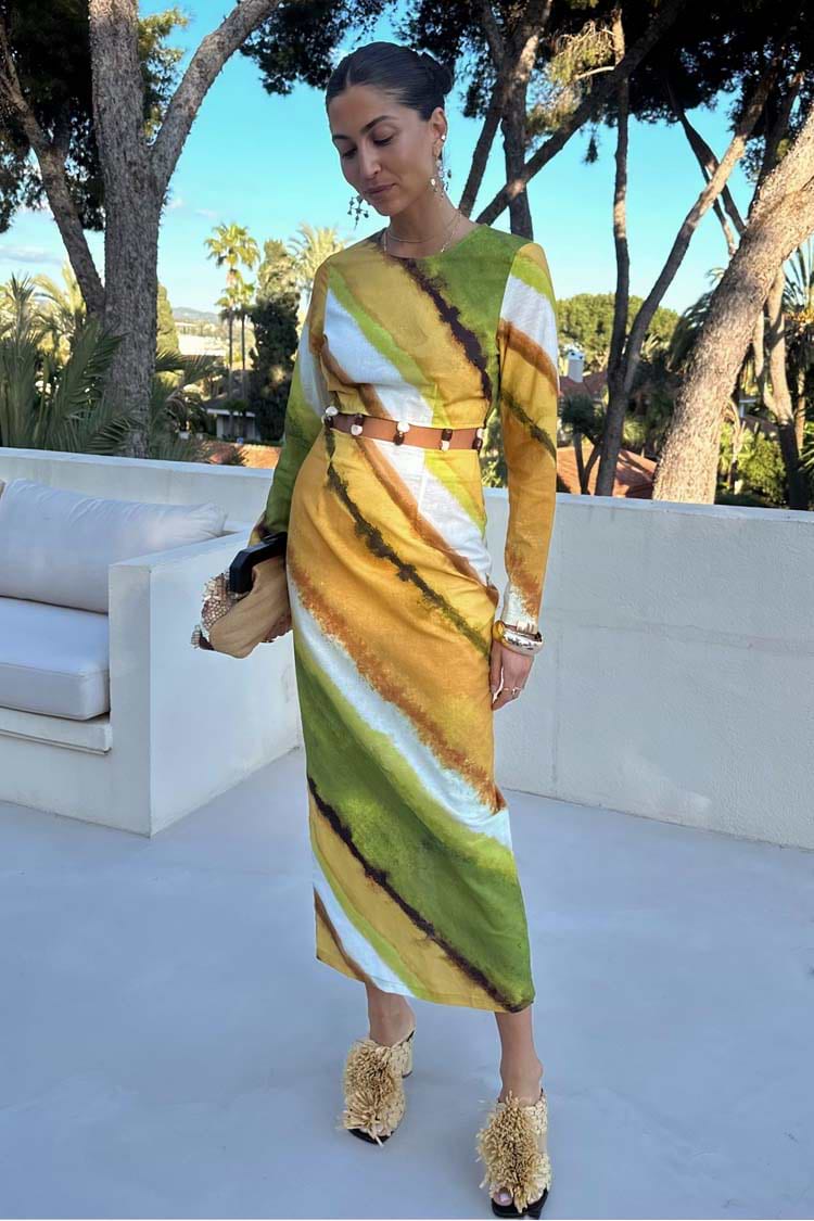Green Ombre Alba Dress in earthy tones with long sleeves and a beaded cut-out waist, styled for vacation.