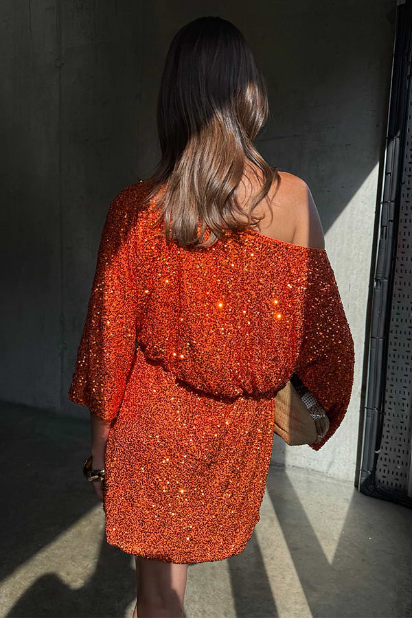 Orange Sequin Tilly Dress in shimmering burnt orange with an off-the-shoulder silhouette and mini length.